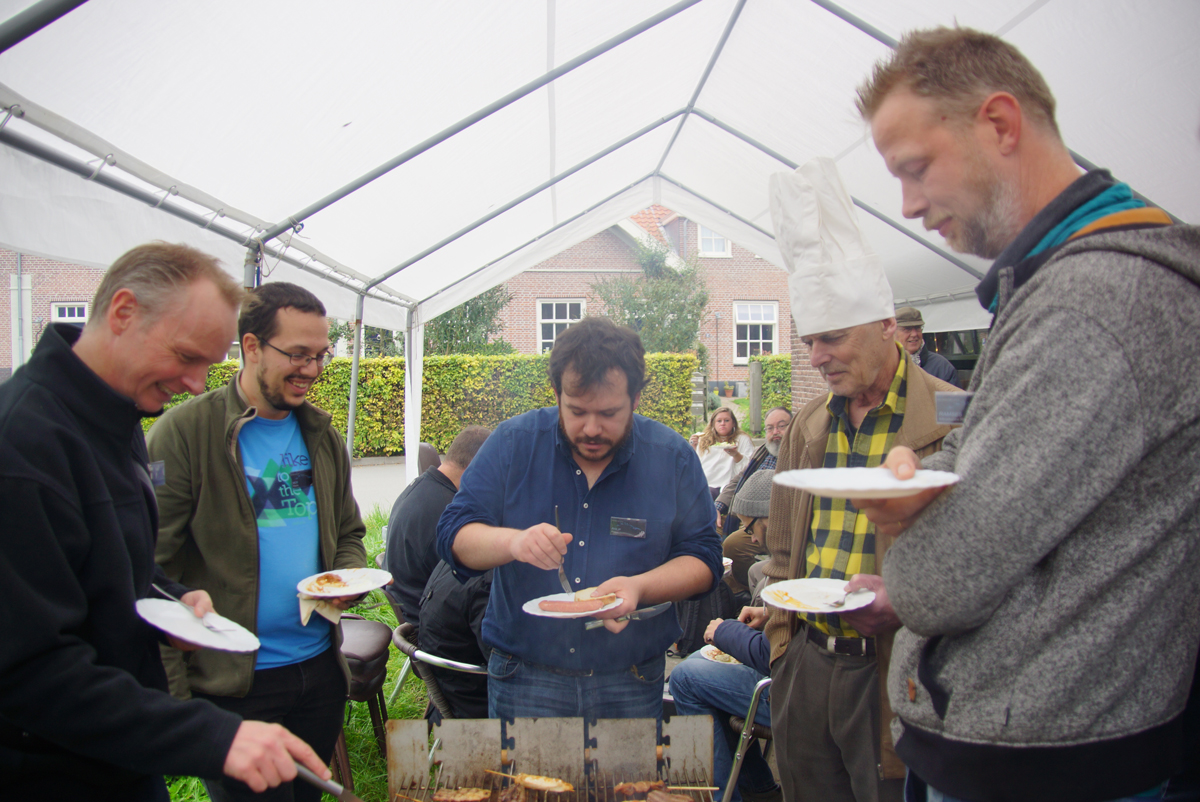 Around the BBQ, the one with the chef's hat is Jos